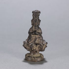 A seated statue of a bronze Buddha in the Ming Dynasty