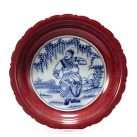 A Qing Dynasty blue and white glazed red figure plate