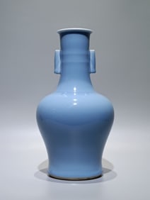 A Qing Kangxi sky-blue glazed piercing ear string pattern flat Guanyin vase