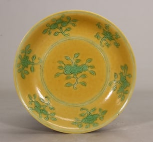 A Ming Dynasty Jiajing yellow ground green flower plate