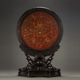 A Qing Dynasty rosewood lacquer dragon pattern insert