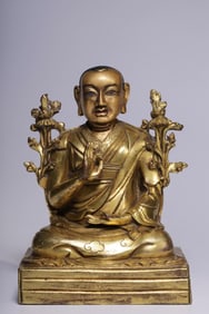 A seated statue of Guru Gyaltsen in bronze gilt in the Qing Dynasty