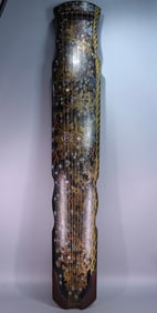 A Qing Dynasty Qianlong year lacquer gold-painted Kowloon guqin