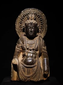 A statue of a Buddha statue of Dhara bluestone,