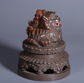 A Qing Dynasty copper gilt silver auspicious beast button seal