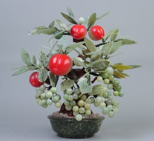 A piece of Xiuyu carved Shou Tao grape bonsai