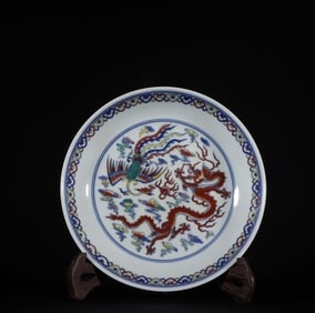 A Qing Dynasty pastel dragon and phoenix plate