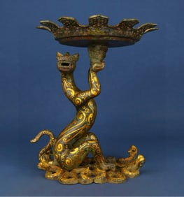 A Han Dynasty bronze Cuojin Pan dragon lamp