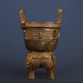 A piece of Western Zhou bronze beast face