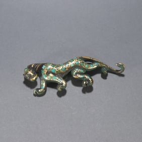 A Han Dynasty bronze with gold inlaid turquoise leopard belt hook