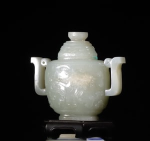 A Qing Dynasty blue and white jade carved gluttonous pattern amphora