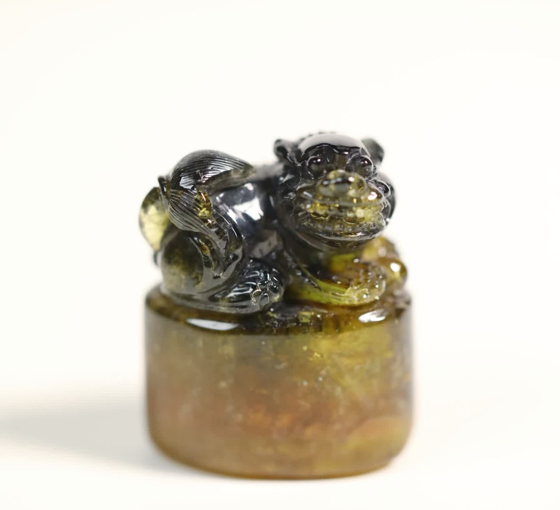 A two-color tourmaline beast button seal (1 of 7)
