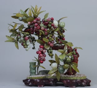 A piece of Xiuyu carved Shou Tao grape bonsai