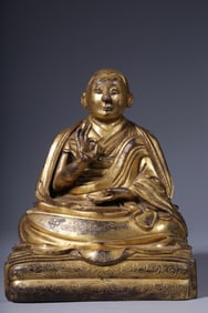 A seated statue of Guru Marpa in copper gilt from the Qing Dynasty