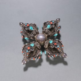 A Qing Dynasty sterling silver inlaid cross vajra