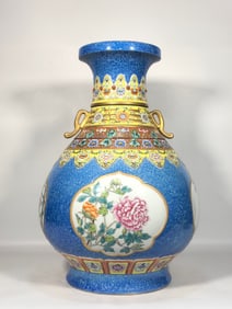 A Qing Qianlong enamel snowflake blue glaze open window four seasons flower turning heart vase