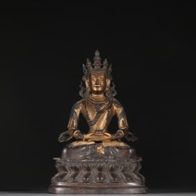 A Qing Dynasty copper-gilt longevity Buddha