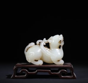 A Qing Dynasty white jade flying Pixiu ornament