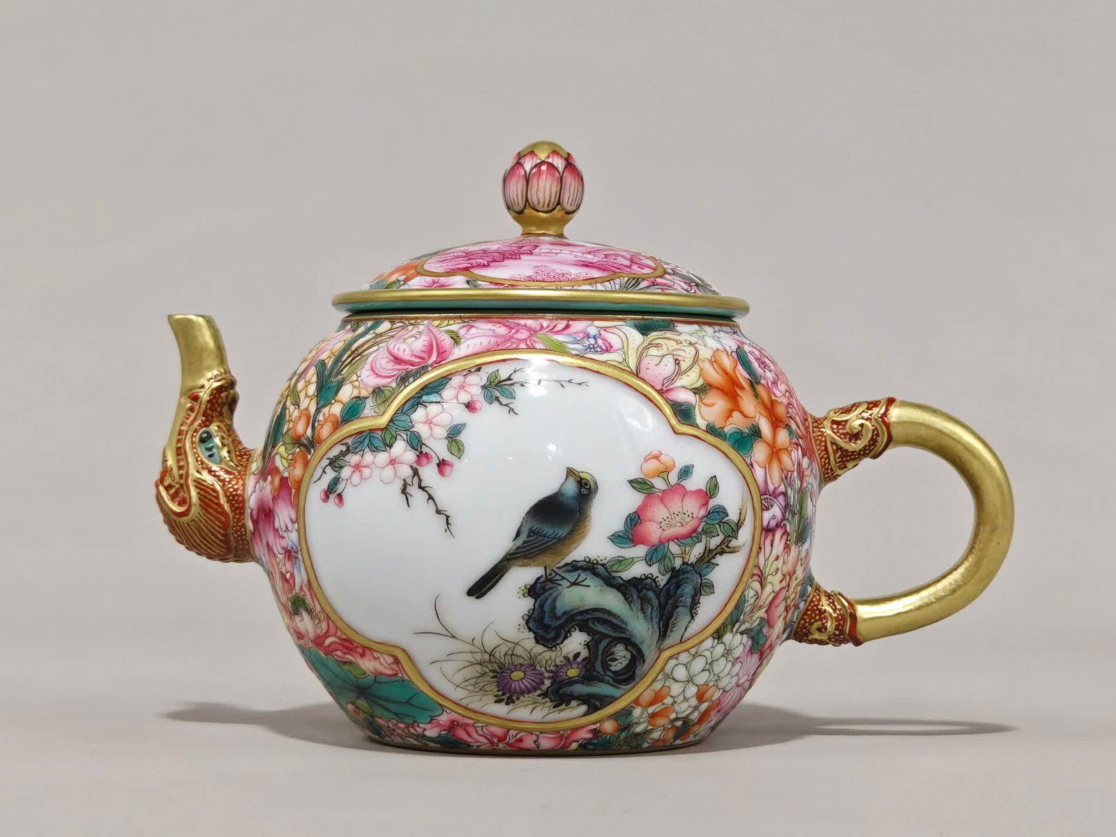 A teapot made in the Yongzheng year of the Qing Dynasty with enamel and colorful flowers blooming in: Qing Dynasty Yongzheng year enamel color kaleidoscope window flowers bloom wealth picture teapot SIZE: H:11cm D:16cm (The Dimensions Of All Batches Are Manually Measured.If You Need More Detailed Info