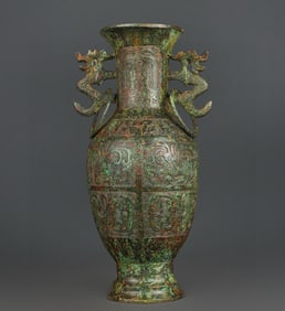 A Han Dynasty bronze double dragon and phoenix bird pattern vase