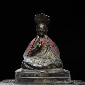 A bronze statue of the Guru Buddha