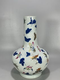 A Qing Dynasty Qianlong year blue flower pastel hundred butterfly bottle