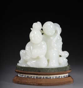 A Qing Dynasty Hetian jade and two immortal ornaments