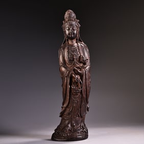 A high-relief carved agarwood station Guanyin Bodhisattva Buddha statue