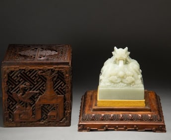 A Qing Dynasty white jade dragon button seal
