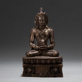 A Qing Dynasty copper-gilt platinum Buddha statue