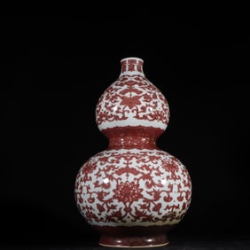 A Qing Dynasty glazed red entwined gourd bottle