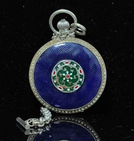 A double-open pocket watch of the sun, moon and stars