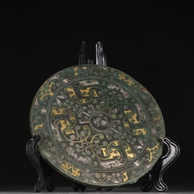 A copper gold and silver mirror