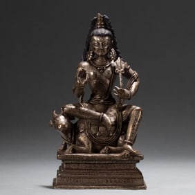 A Qing Dynasty copper-gilt platinum Buddha statue