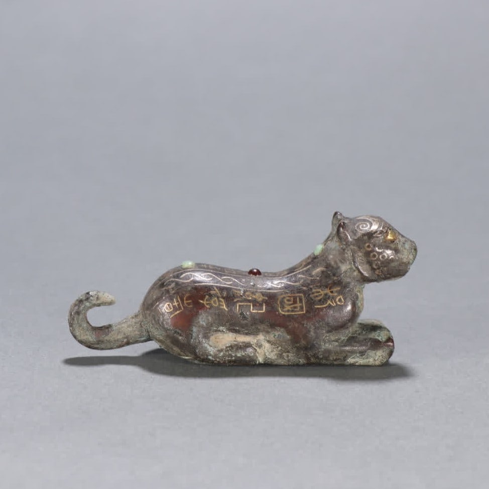 A Han Dynasty bronze gold and silver tiger ornament (1 of 9)