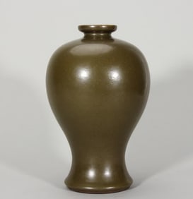 A Qing Dynasty Qianlong factory official glazed plum bottle