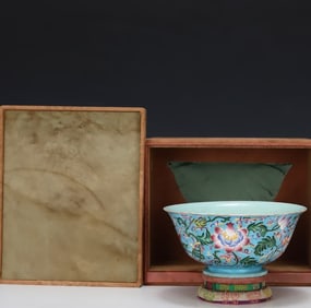 A Qianlong year sky blue glazed enamel flower bowl