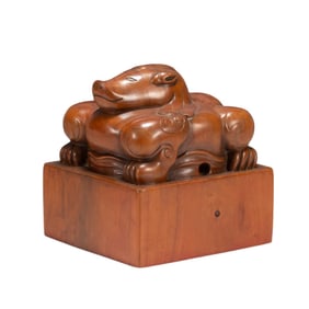 A Qing Dynasty sandalwood beast button seal