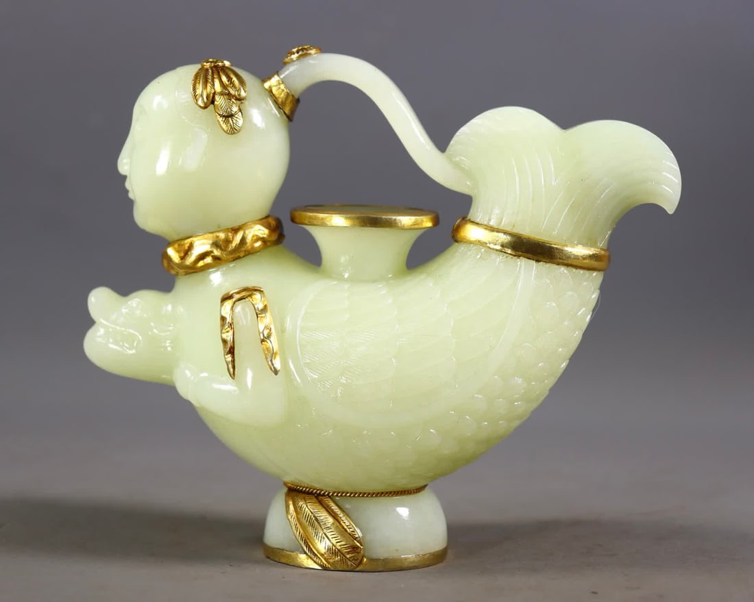 A Qing Dynasty Hetian jade-wrapped golden mermaid pot: Qing Dynasty Hetian jade-wrapped golden mermaid pot SIZE: H:14cm L:15cm W:6cm W:684g (The Dimensions Of All Batches Are Manually Measured.If You Need More Detailed Information, Please Contact Our Cust