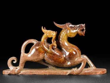 An ancient jade dragon horse carving