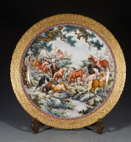 A large plate with carved edges and gold