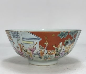 A lacquered red ground boy music pattern bowl made in the Qianlong period of the Qing Dynasty