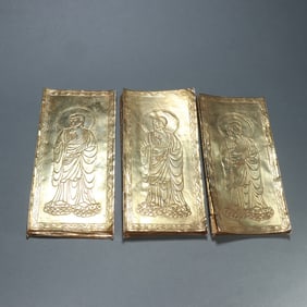 A set of Qing Dynasty silver-gilt Buddha pattern scriptures