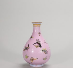 A Qing Dynasty Yongzheng pastel palace powder rolled road hundred butterfly jade pot spring vase