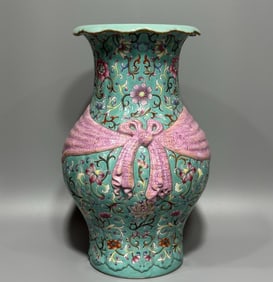 A Qing Dynasty Qianlong year pastel turquoise green entwined pattern vase