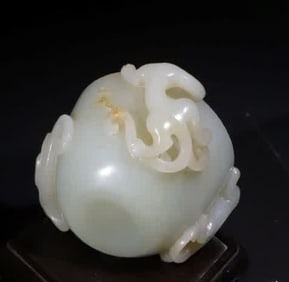 A Qing Dynasty blue and white jade dragon cup
