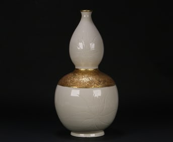 A Song Dynasty Ding kiln white porcelain carved silver gilt gourd bottle