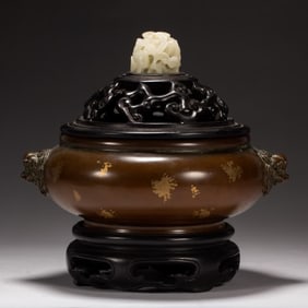 A Qing Dynasty copper-dotted gold beast ear furnace