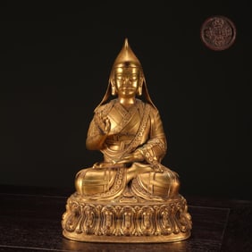 A seated statue of Tsongkhapa's disciple Kezhujie, a finely cast copper tire