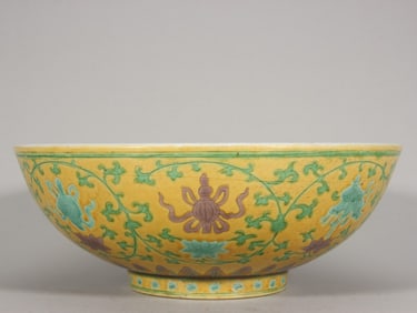 A large bowl with eight treasure patterns carved in Jiajing yellow ground in the Ming Dynasty